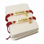 02 Manilla Pulsera tejida placa en acero grabada láser